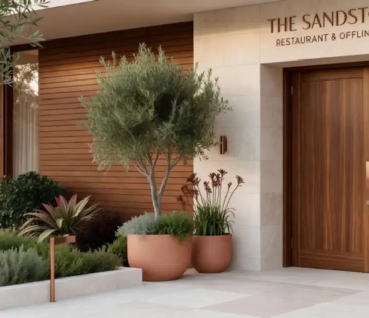 Entrance to a premium Australian restaurant and poker lounge with warm stone and copper details.
